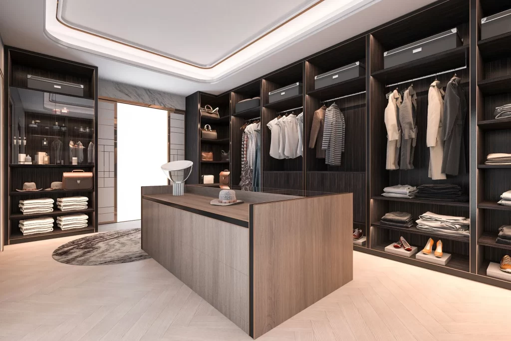 Walk-in luxury closet with custom dark wood shelves and organization system