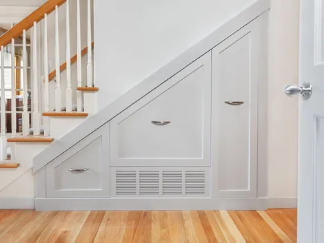 Under stairs white pullout custom cabinets